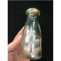 EMBOSSED SASKATCHEWAN COOPERATIVE CREAMERIES ADVERTISING MILK BOTTLE (1/2 PINT) *VINTAGE*