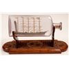 Image 1 : Ship in a Bottle with Wood Cradle   (106508)