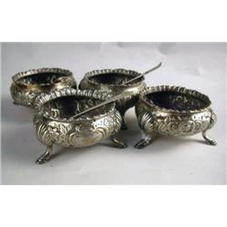 FOUR ENGLISH SILVER FOOTED ROCOCO MOTIF CHASED SA