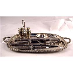 A DOUBLE HANDLED SILVER PLATED TRAY WITH MISCELLA