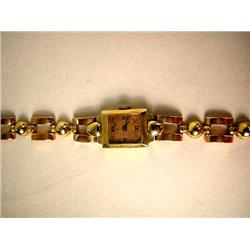 A SWISS 18KT TWO COLORED YELLOW GOLD LADY'S WRIST