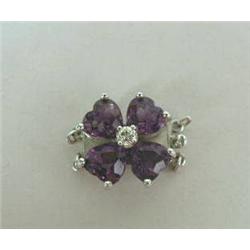 A 14KT WHITE GOLD VIOLET-FORM PEARL CLASP, the fl