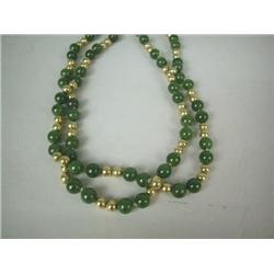 A JADEITE AND YELLOW GOLD BEAD NECKLACE, 14-1/2 l