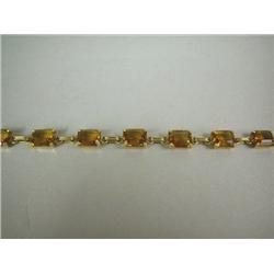 A YELLOW GOLD AND CITRINE QUARTZ BRACELET, 6"l