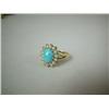 Image 1 : A YELLOW GOLD, DIAMOND AND TURQUOISE RING