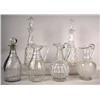 Image 1 : THIRTEEN COLORLESS GLASS DECANTERS AND PITCHERS