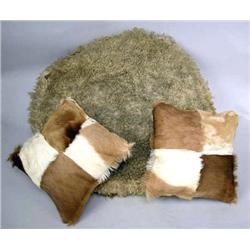 THREE PILLOWS One with sheepskin, to cowhide