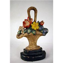 A PAINTED BASKET FORM IRON DOORSTOP 8"h