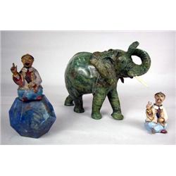 A CARVED GREEN STONE ELEPHANT
