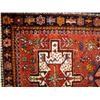 Image 1 : A TRIBAL STYLE SMALL RUG With a scarlet field, wi