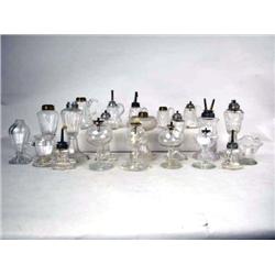 AN ASSORTED GROUP OF COLORLESS GLASS FLUID LAMPS 