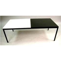 A CONTEMPORARY FORMICA MOUNTED LOW COFFEE TABLE