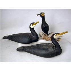 A GROUP OF THREE CARVED AND PAINTED CORMORANT DEC