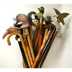 AN ASSORTED GROUP OF WALKING STICKS Hand holds pr