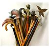 Image 1 : AN ASSORTED GROUP OF WALKING STICKS Hand holds pr