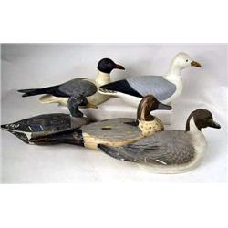 A MISCELLANEOUS GROUP OF PAINTED DECOYS Comprisin