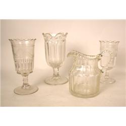 THREE COLORLESS GLASS CELERY JARS Together with a