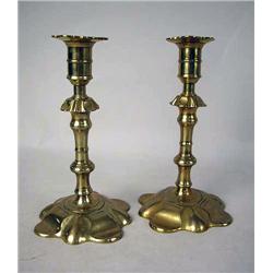 A PAIR OF CAST-BRASS PETAL-BASED CANDLESTICKS pro