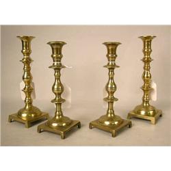 TWO PAIR OF CAST-BRASS FOOTED SQUARE-BASED CANDLE