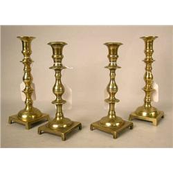 TWO PAIR OF CAST-BRASS FOOTED SQUARE-BASED CANDLE