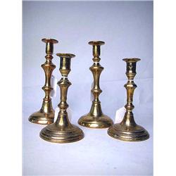 TWO PAIR OF BELL-METAL CIRCULAR-BASED CANDLESTICK