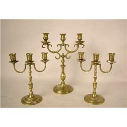 A GROUP OF THREE-ARMED CANDLESTICKS Continental, 