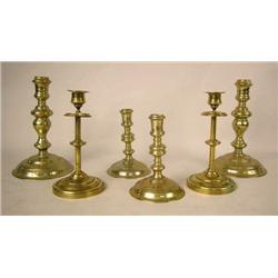 THREE PAIR OF CAST-BRASS CIRCULAR-BASED CANDLESTI