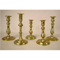 TWO PAIR OF CAST-BRASS CIRCULAR-BASED CANDLESTICK