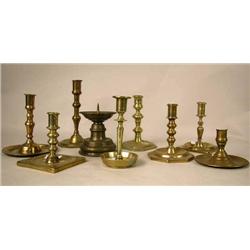 A GROUP OF NINE ASSORTED CAST-BRASS CANDLESTICKS 