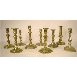 A GROUP OF NINE ASSORTED CAST-BRASS CANDLESTICKS 