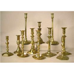 A GROUP OF ELEVEN ASSORTED CAST-BRASS CANDLESTICK