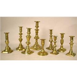 A GROUP OF NINE ASSORTED CAST-BRASS CANDLESTICKS 