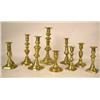 Image 1 : A GROUP OF NINE ASSORTED CAST-BRASS CANDLESTICKS 