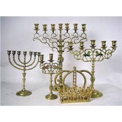 A GROUP OF FIVE ASSORTED CAST-BRASS MENORAHS mino