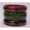 Image 1 : Three bakelite bangles including one medium green