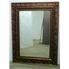 Image 1 : Gilt framed beveled mirror; ornate oak leaf and s