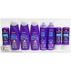 BAG OF AUSSIE SHAMPOO AND CONDITIONERS.