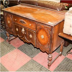 ANTIQUE BUFFET WITH ORNATE ACCENTS