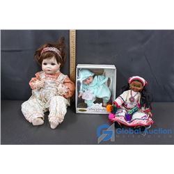 A Porcelain Baby, Baby Amanda (still in Box), and Plastic Doll with Bead Work