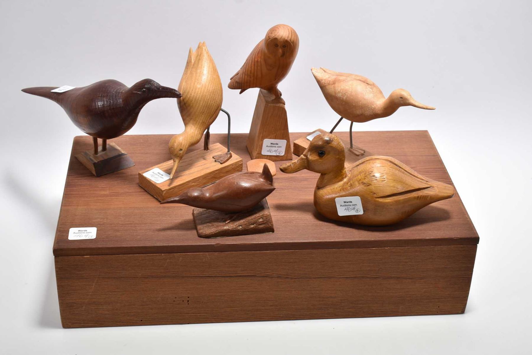 Six hand carved wooden birds, all signed or labelled by artist Randall