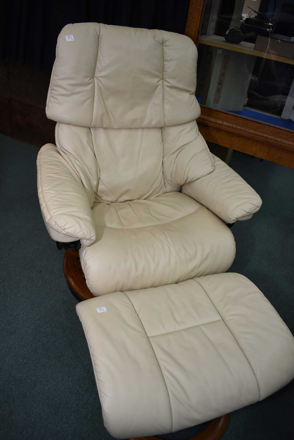 Mid century designed swivel recliner with leather upholstery and