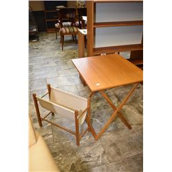 Two pieces of mid century furniture including Danish Spottrup folding table and a teak framed textil