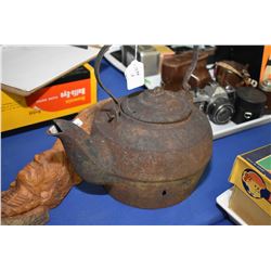 Antique cast iron water kettle and a carved wooden Indian bust signed by artist K. Kaiser