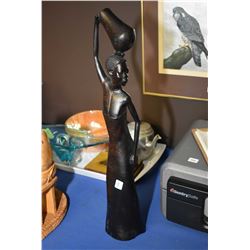 Hand carved ironwood sculpture of a woman with her water jug 24" in height