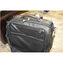 Leather Briggs & Riley leather carry-on bag and pull-out handle and wheels