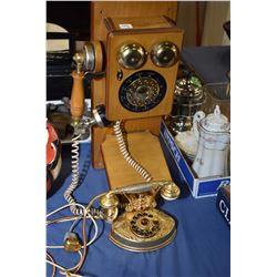 Two antique style phones including a push button wall phone and a French style bedroom phone