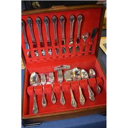 Walnut canteen containing Rogers Bros. "Remembrance' flatware including eight each of dinner knives,