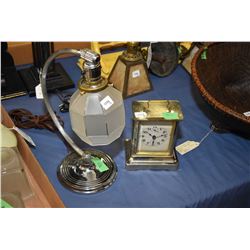 Vintage chrome desk lamp with frosted shade and an antique chromed mantle clock