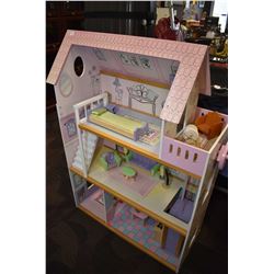 Child's dollhouse with assorted wooden furnishing and movable elevator