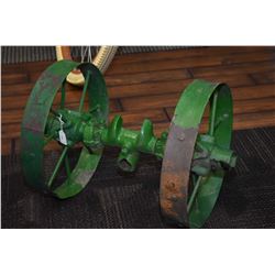 Pair of implement wheels on an axle